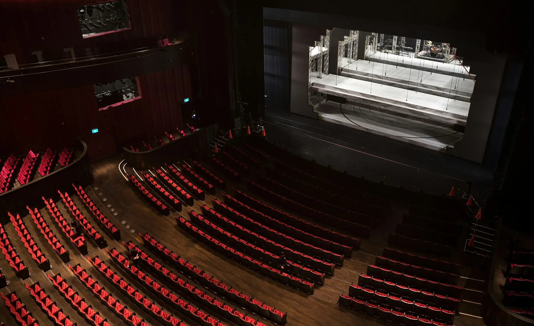The Pallas auditorium seen from the balcony, with red seats facing the stage